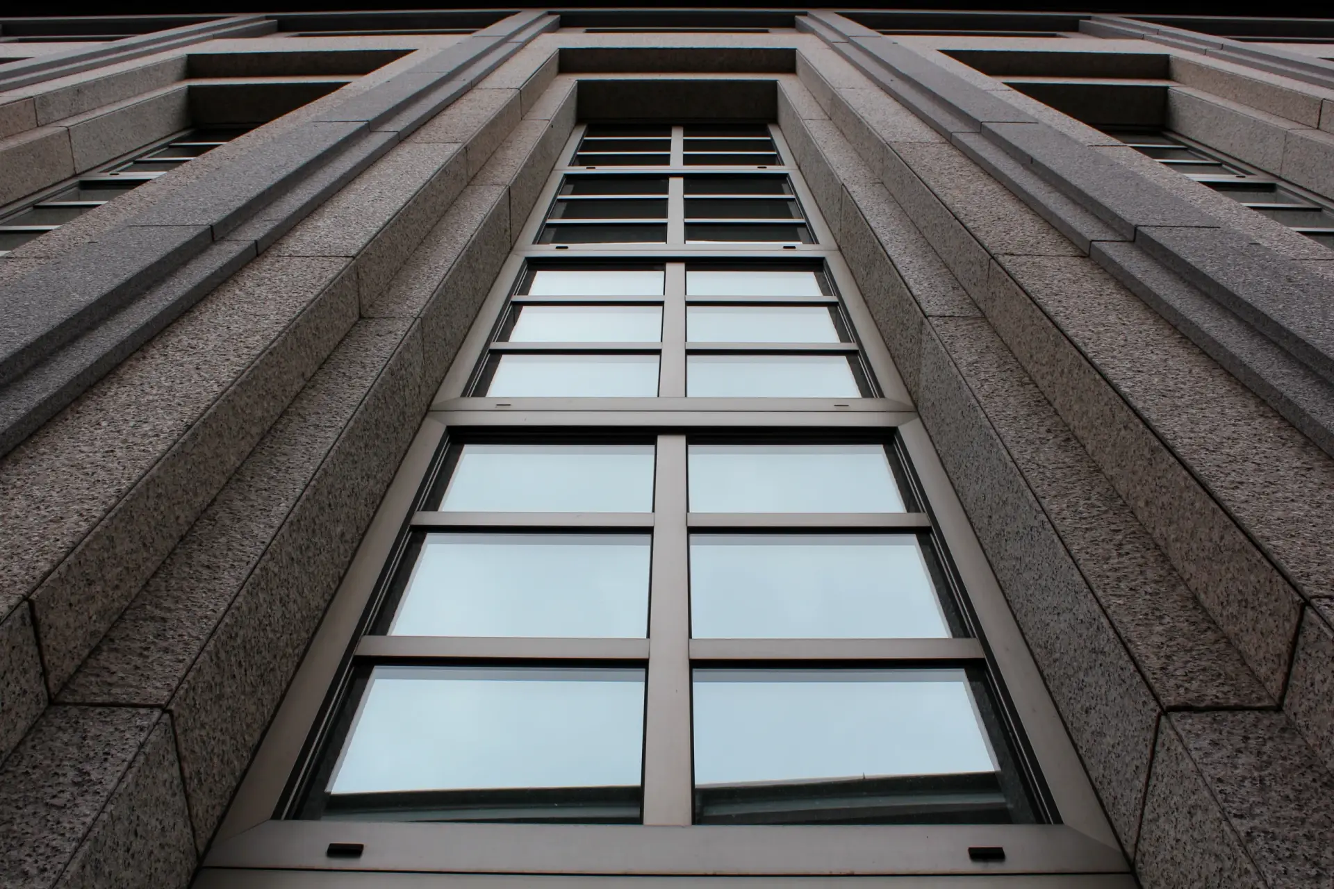 directly-shot-modern-building-against-sky